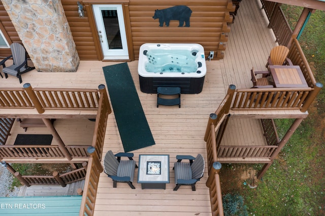 wooden deck with a fire pit