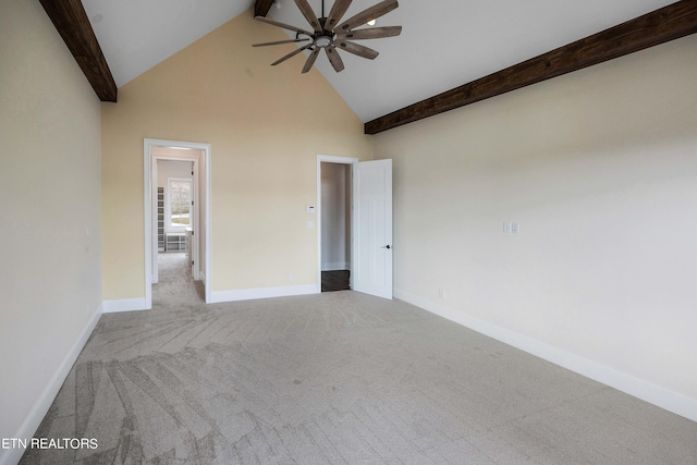 spare room featuring light carpet, beam ceiling, high vaulted ceiling, and ceiling fan