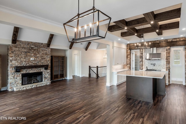 kitchen with a center island, white cabinetry, dark hardwood / wood-style floors, and pendant lighting