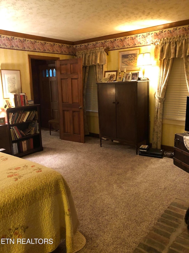 carpeted bedroom featuring a textured ceiling