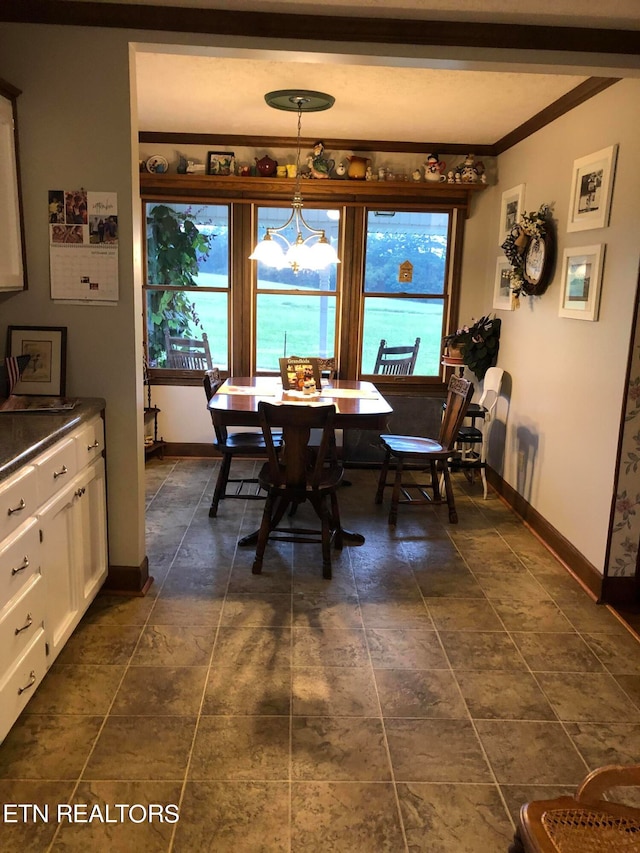 tiled dining room with crown molding and a notable chandelier