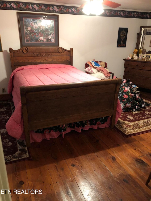 bedroom featuring ceiling fan and hardwood / wood-style floors