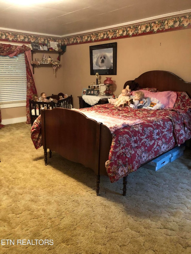 bedroom with carpet floors and ornamental molding