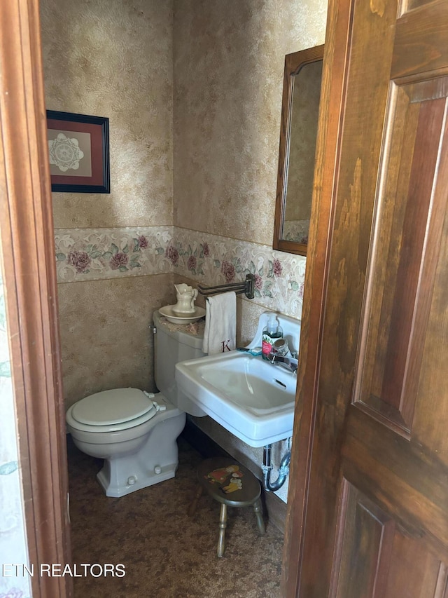 bathroom featuring sink and toilet