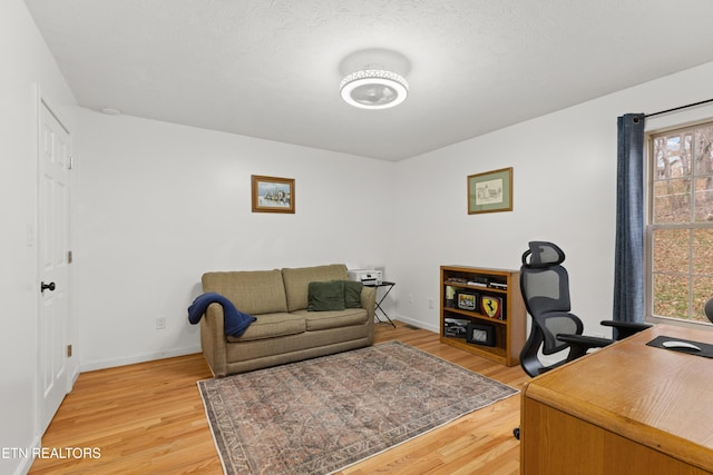 office area with wood-type flooring and a wealth of natural light