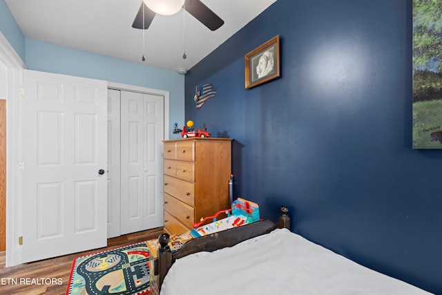 bedroom featuring ceiling fan, a closet, and wood-type flooring