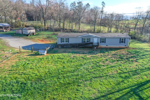 view of front of house with a storage shed