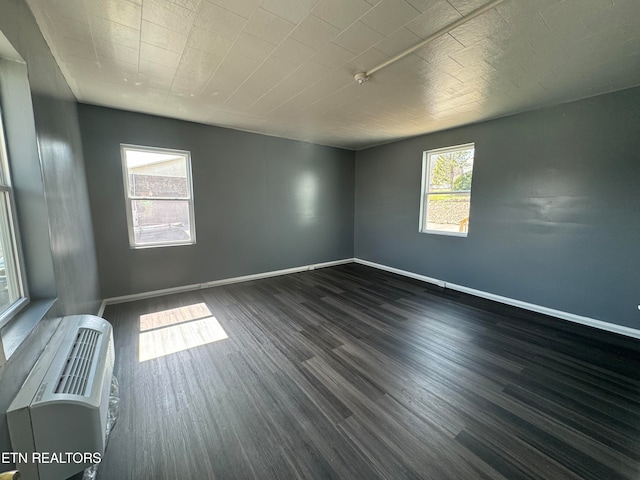 unfurnished room featuring dark hardwood / wood-style floors