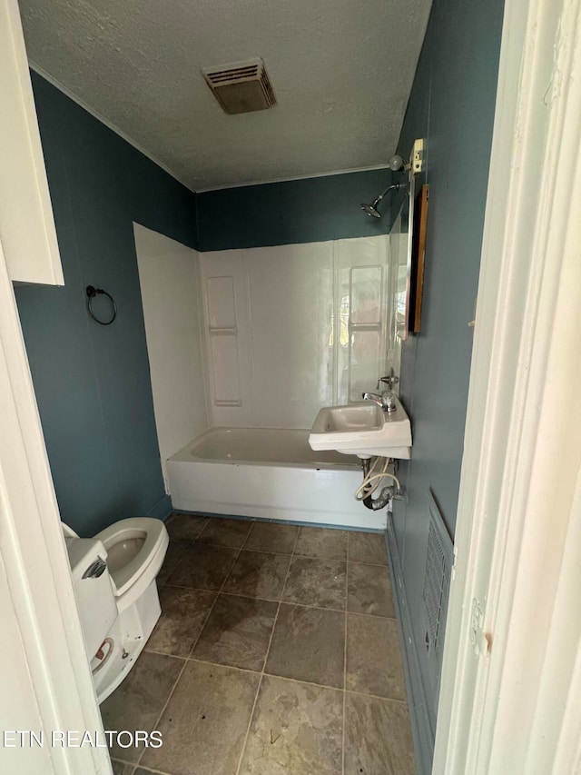 full bathroom with sink, tile flooring, toilet, and bathtub / shower combination