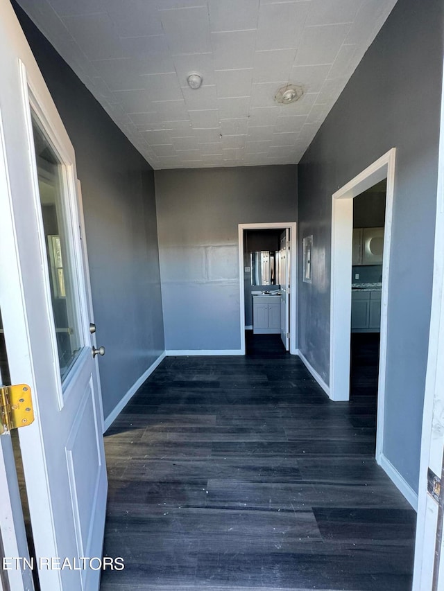 foyer entrance featuring dark hardwood / wood-style floors