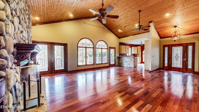 unfurnished living room with ceiling fan, french doors, dark wood-type flooring, high vaulted ceiling, and wooden ceiling