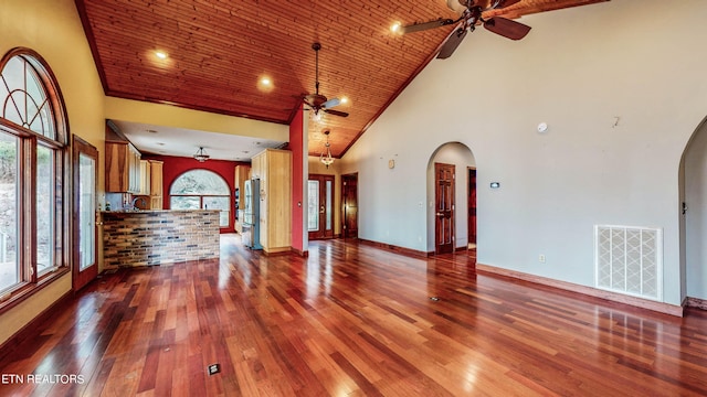 unfurnished living room with high vaulted ceiling, ceiling fan, and dark hardwood / wood-style flooring