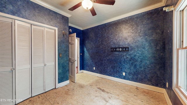 unfurnished bedroom with crown molding, a closet, and ceiling fan