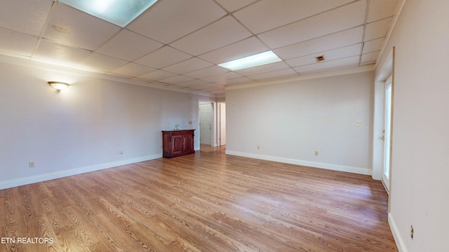 interior space with hardwood / wood-style floors and a paneled ceiling