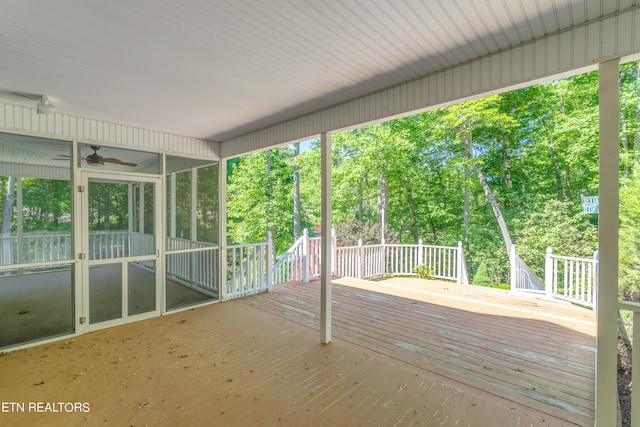 wooden deck featuring ceiling fan