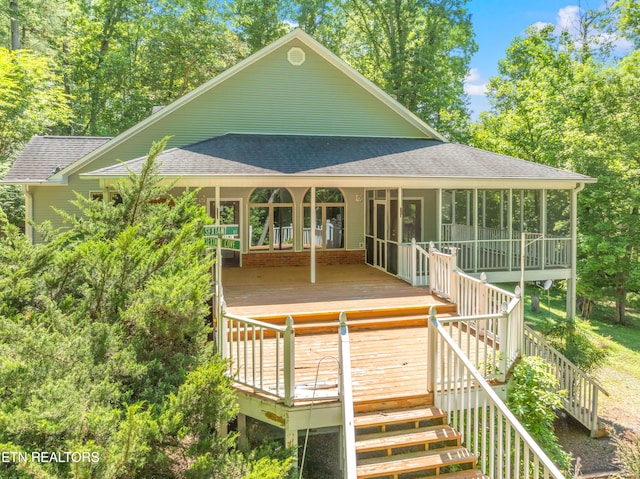 rear view of property with a wooden deck