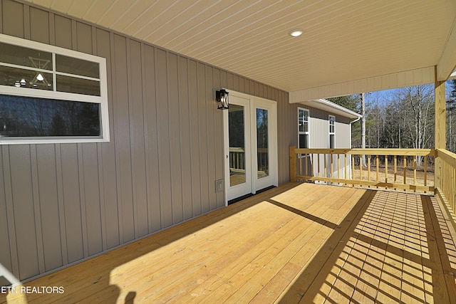 wooden deck featuring french doors