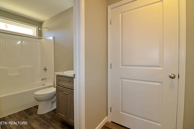 full bathroom with vanity, toilet, bathtub / shower combination, and hardwood / wood-style flooring