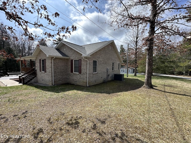 view of home's exterior featuring a lawn