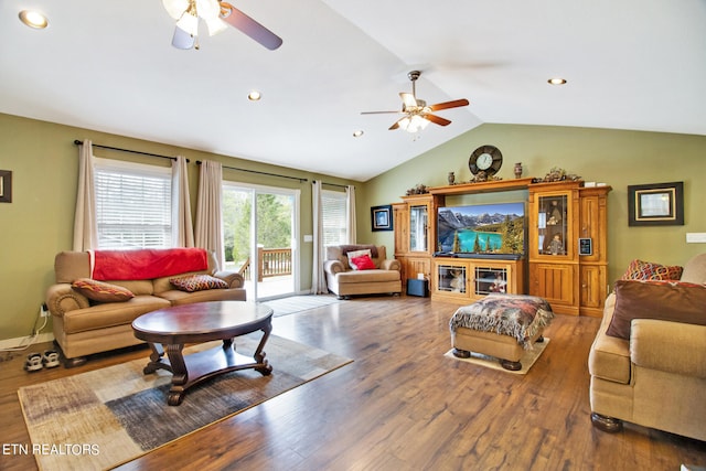 living room featuring vaulted ceiling, ceiling fan, and hardwood / wood-style flooring