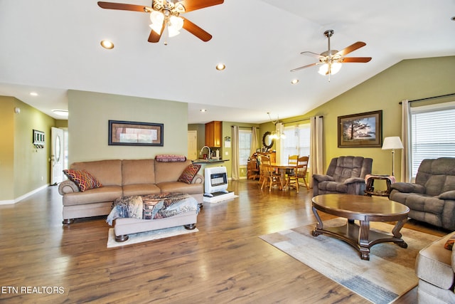 living room featuring sink, lofted ceiling, ceiling fan, and hardwood / wood-style flooring