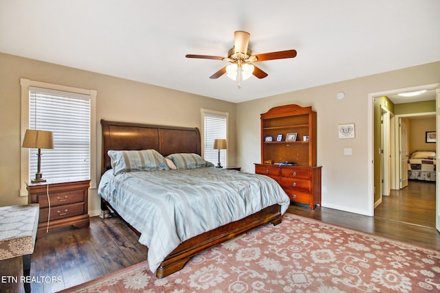 bedroom featuring dark hardwood / wood-style floors and ceiling fan