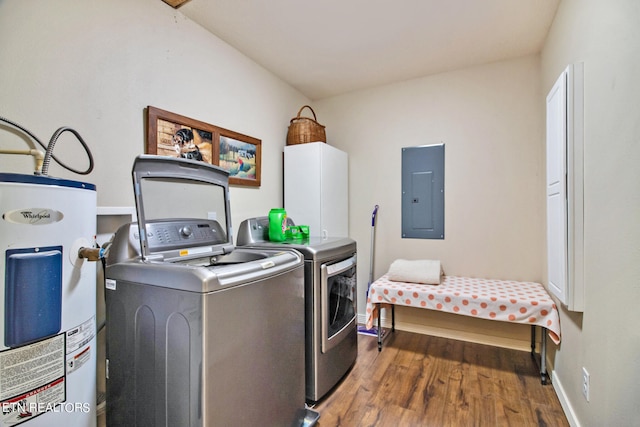 laundry room with washer and clothes dryer, electric water heater, and dark hardwood / wood-style flooring