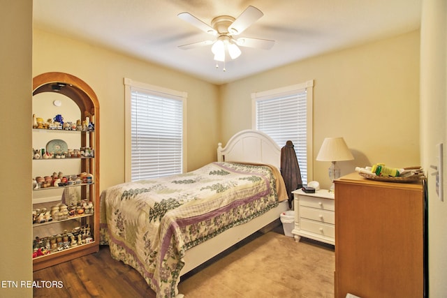 bedroom with ceiling fan and light wood-type flooring