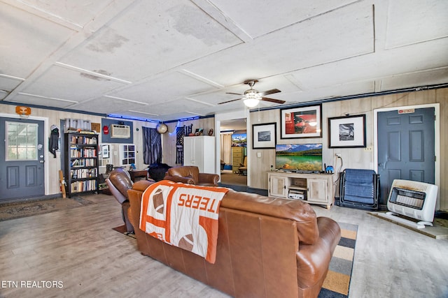 living room featuring ceiling fan and light hardwood / wood-style flooring