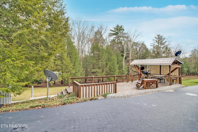 view of front of property featuring a wooden deck