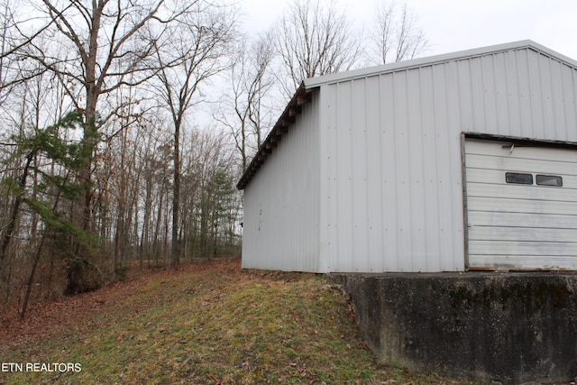 view of side of home with an outdoor structure