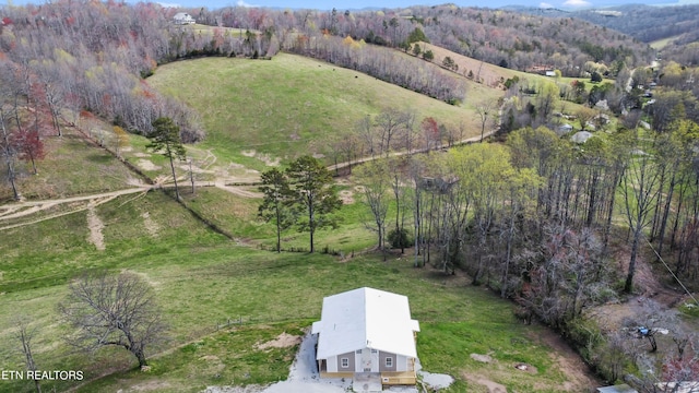 birds eye view of property featuring a rural view