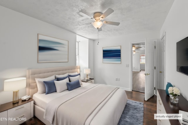 bedroom featuring dark hardwood / wood-style floors and ceiling fan