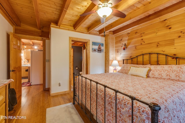 bedroom with wood walls, wooden ceiling, and beamed ceiling