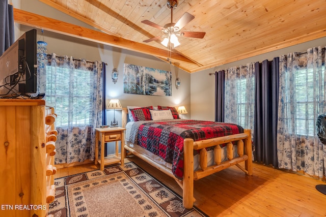 bedroom with lofted ceiling, light hardwood / wood-style flooring, and wood ceiling