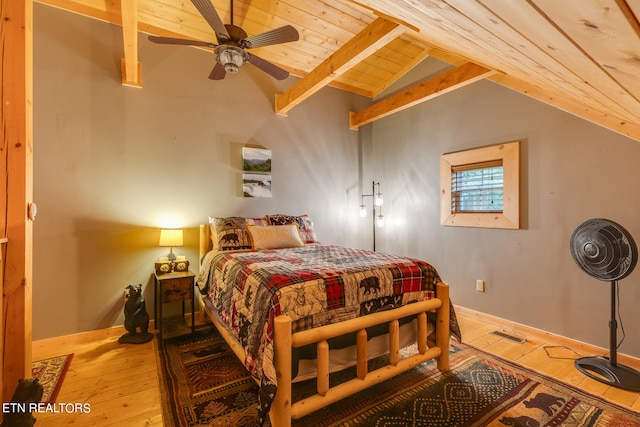 bedroom with ceiling fan, wood ceiling, vaulted ceiling with beams, and light wood-type flooring