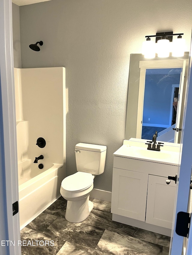 full bath with a textured wall, vanity, shower / tub combination, and toilet