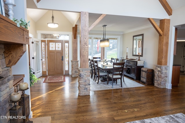 foyer featuring lofted ceiling, crown molding, and dark hardwood / wood-style floors