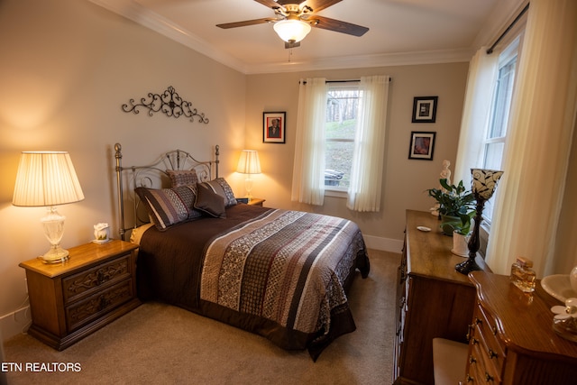 bedroom featuring crown molding, ceiling fan, and carpet floors