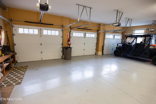 garage featuring a garage door opener