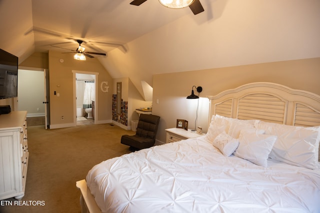 bedroom with ensuite bath, light colored carpet, vaulted ceiling, and ceiling fan