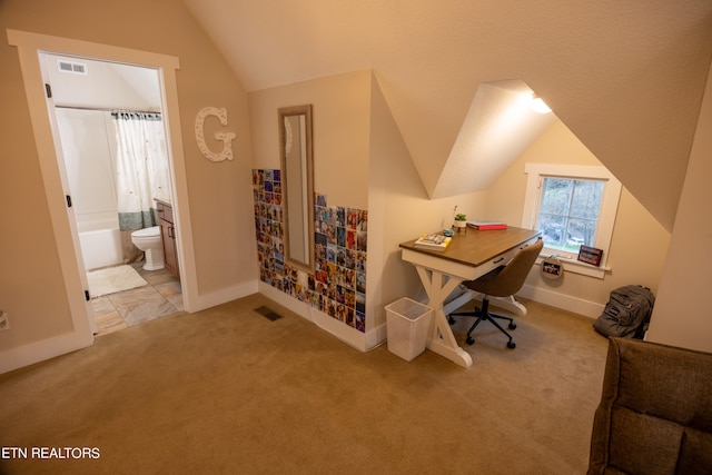 office space with light carpet and lofted ceiling