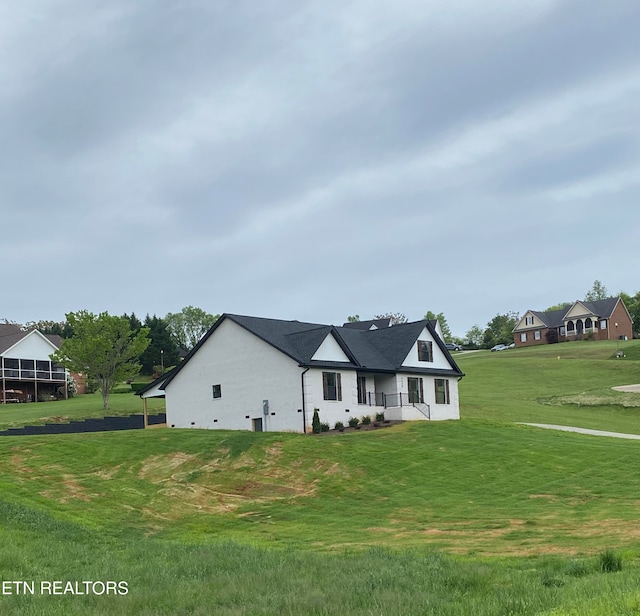 view of front of house with a front lawn