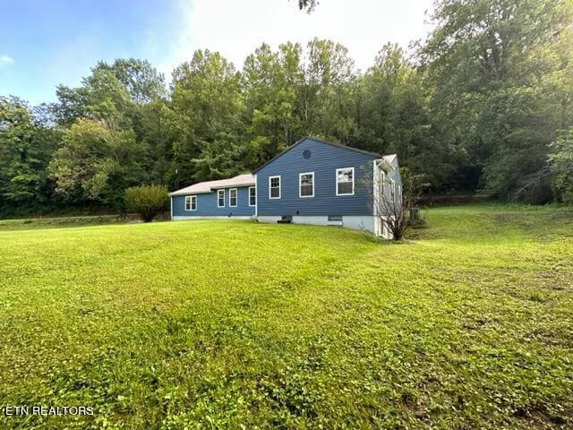 view of front of home with a front lawn