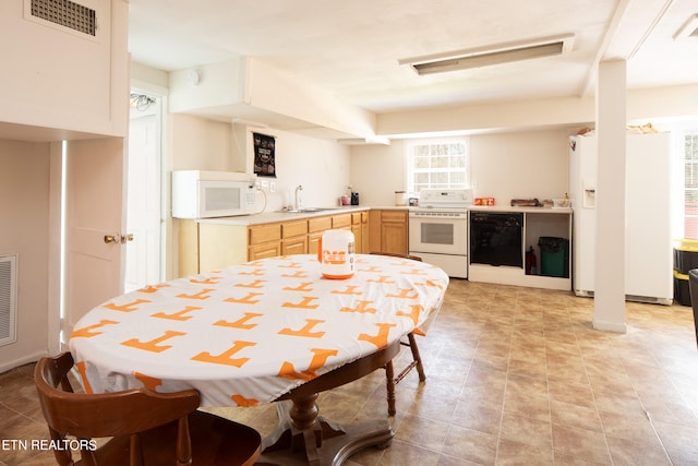 tiled dining area featuring sink