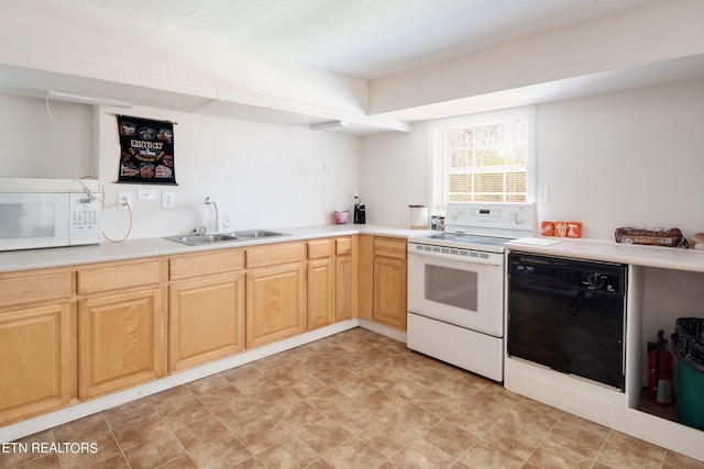 kitchen with light brown cabinetry, white appliances, light tile flooring, and sink