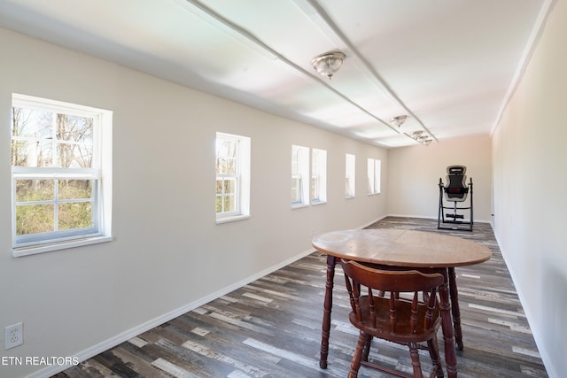 unfurnished dining area featuring dark hardwood / wood-style floors and a wealth of natural light