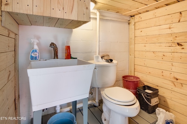 bathroom with toilet and wooden ceiling