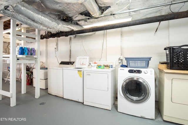 laundry area featuring separate washer and dryer