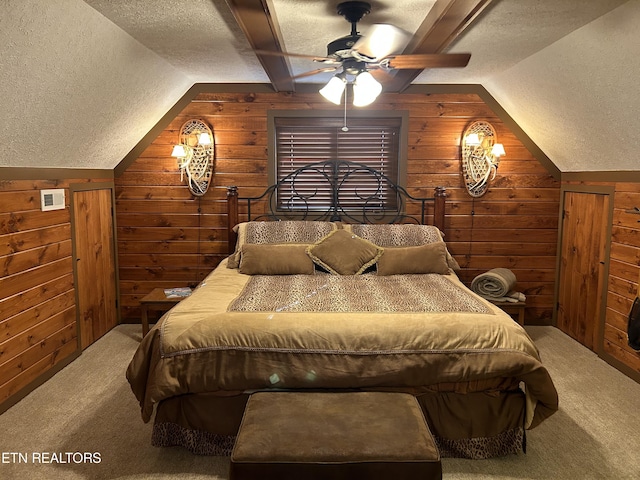 bedroom with carpet floors and wooden walls